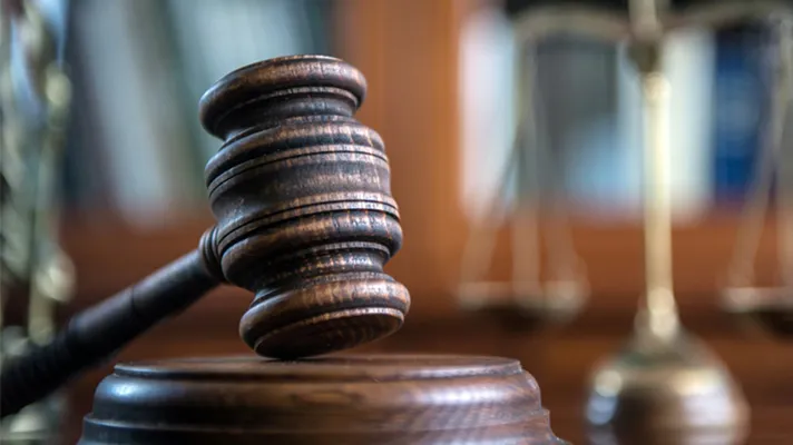 Gavel and courtroom scene