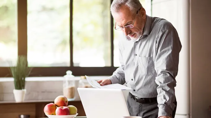 Senior patient using a computer.