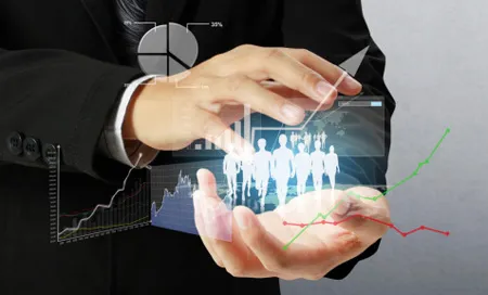Businessman holding graphs