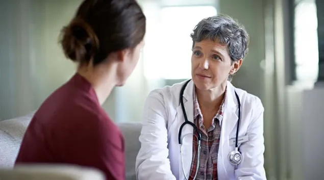 Doctor speaking with patient