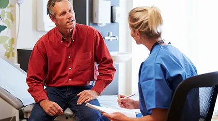 doctor speaking with patient