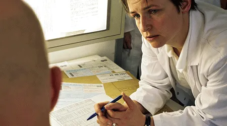 doctors talking over paperwork