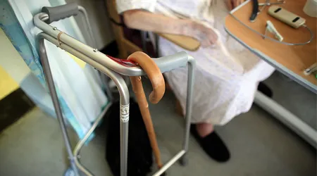 elderly person in hospital with cane