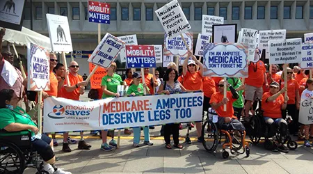 Amputees protest on Aug. 26 outside the Department of Health and Human Services.