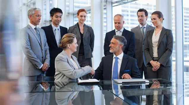 Executives shaking hands