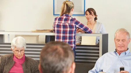 patients at reception desk