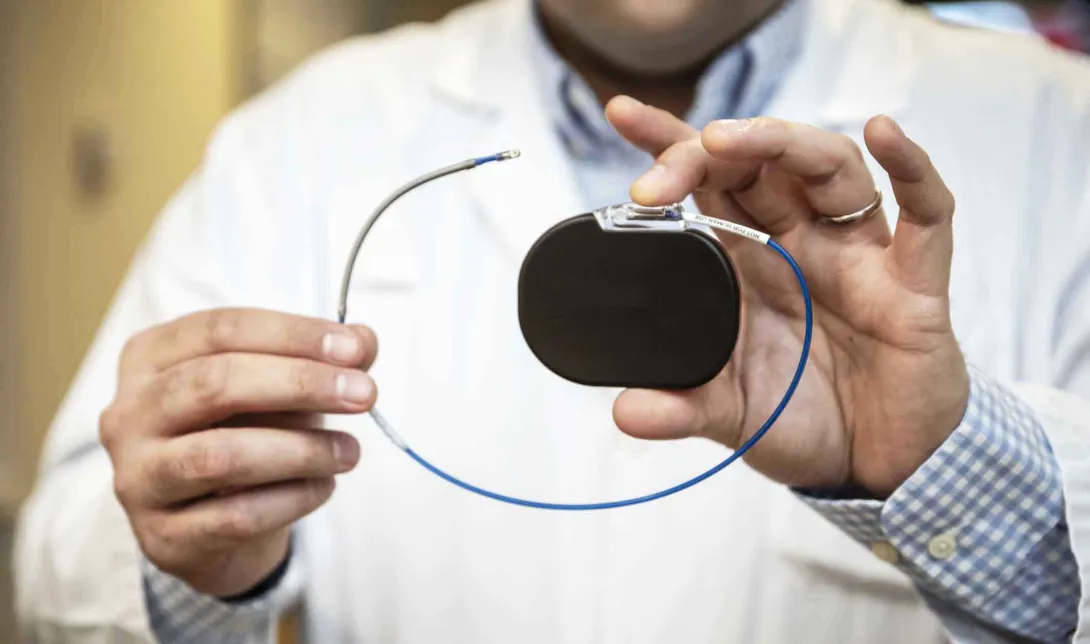 Doctor holding pacemaker
