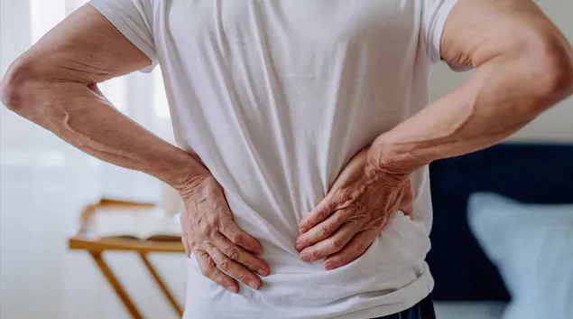 Man clutching his lower back