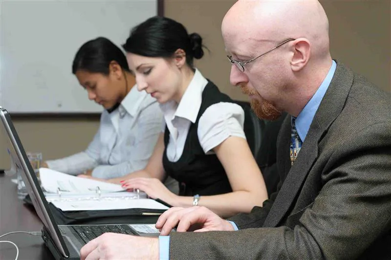 Three people working