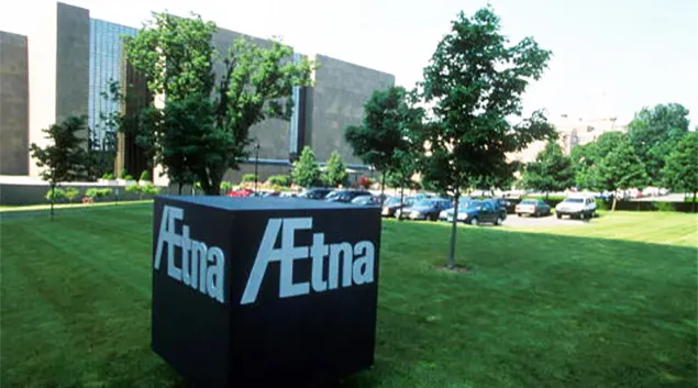 Aetna sign on block in front of building complex