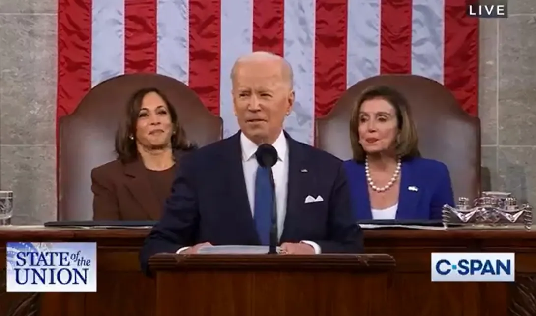 President Biden speaking, with V.P. Harris and Speaker Pelosi seated behind him. Photo: C-Span