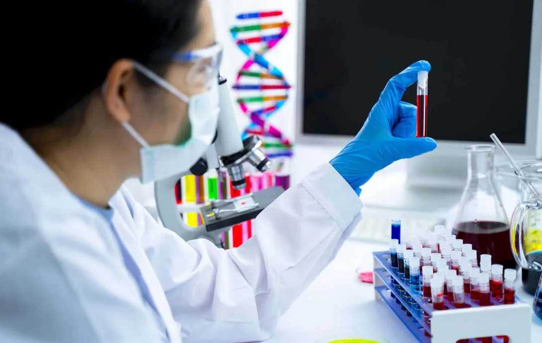 Researcher with blood test