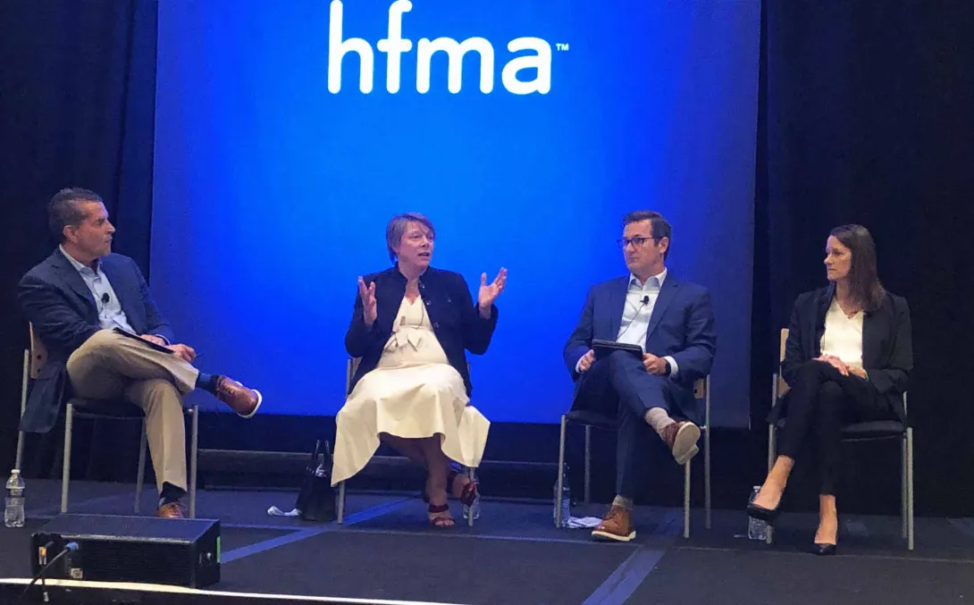 OSF HealthCare CFO Michael Allen, Henry Ford Health Executive VP and CFO Robin Damschroder and Jana Cook, senior VP and CFO for Phelps Health, take questions from moderator Norman Mosrie of Forvis at the HFMA annual conference.