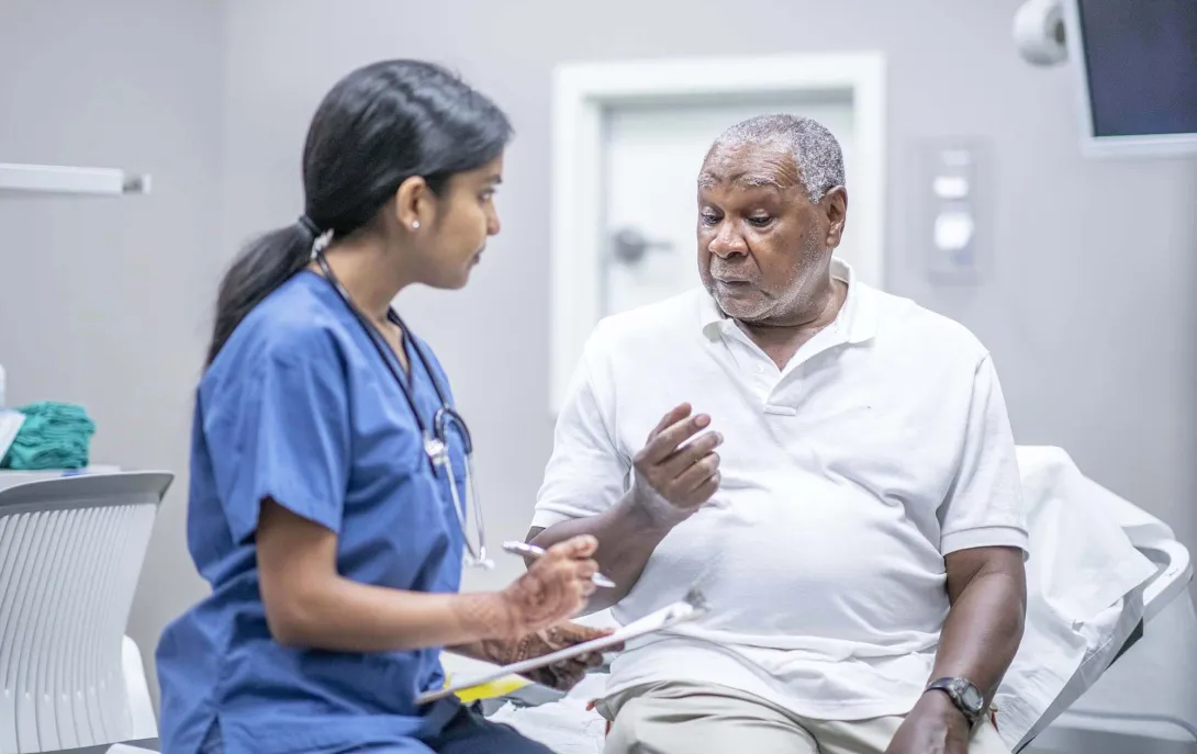 Patient conferring with doctor
