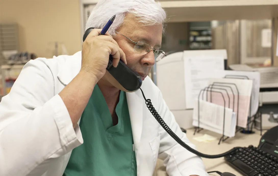 Healthcare professional on landline phone