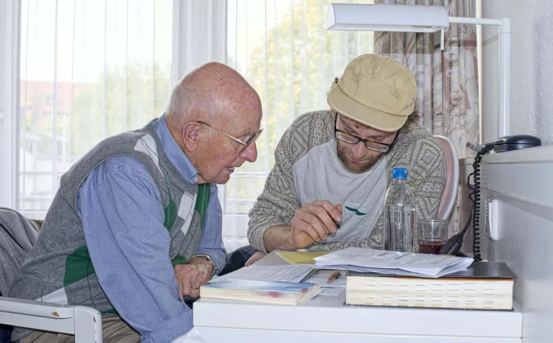 People going over papers at table