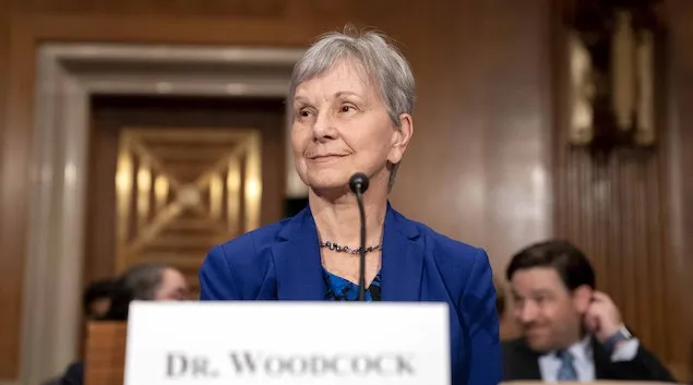 Acting FDA Commissioner Janet Woodcock sitting at a microphone