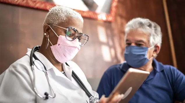 A physician and patient office visit