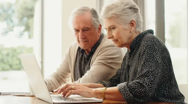 Couple using a laptop