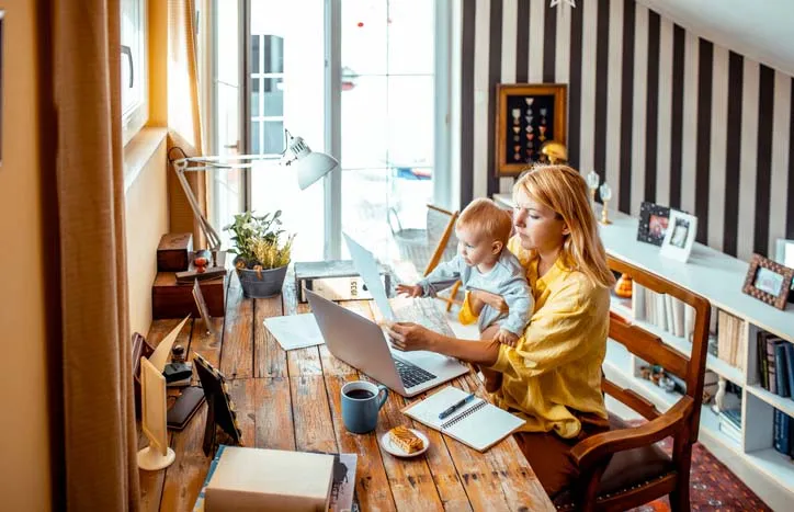 Adult and child at computer. Photo: Marko Geber/Getty Images