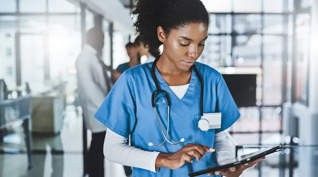 Nurse accessing an EHR on a tablet