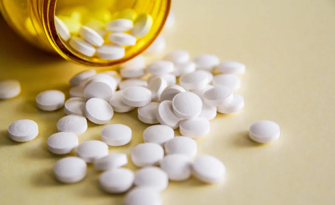 Pills spilling out of a bottle