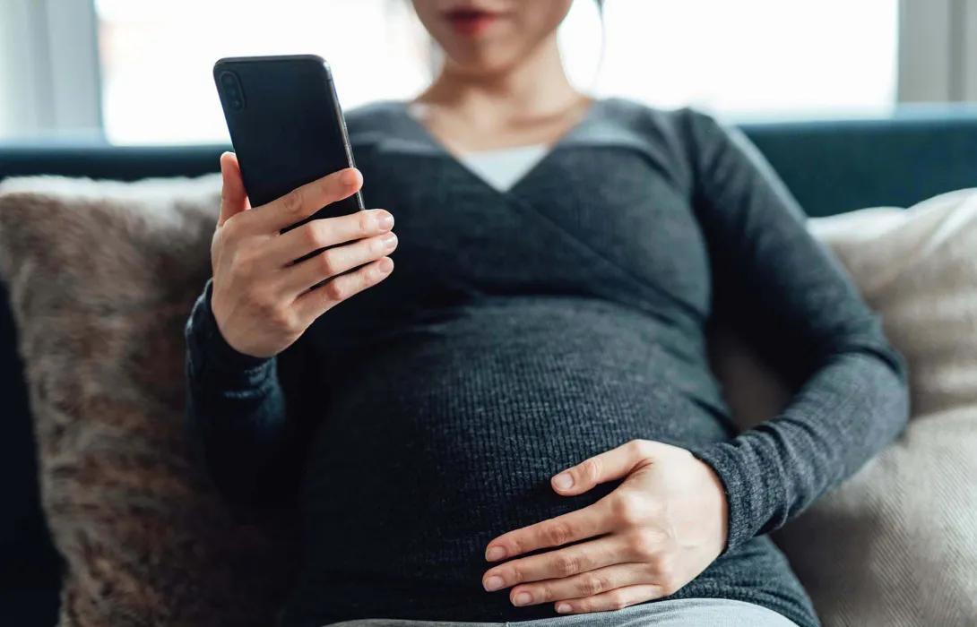 Pregnant woman on phone
