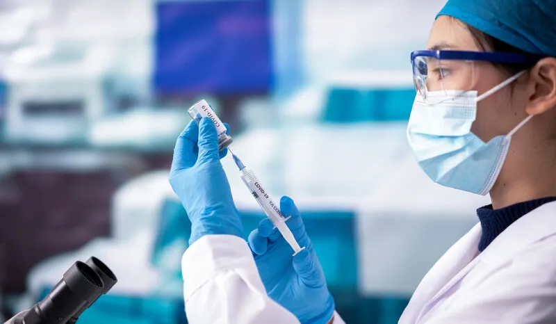 Clinician with syringe