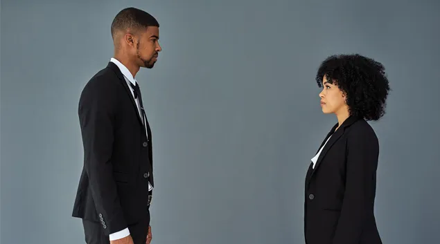 Two businesspeople face each other