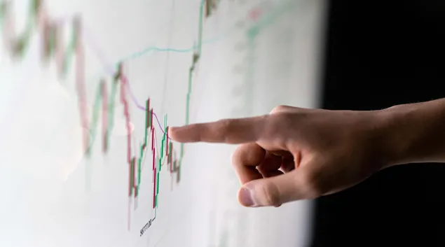 Finger pointing to a graph