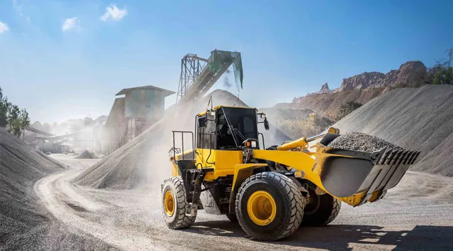 Construction vehicle moving dirt