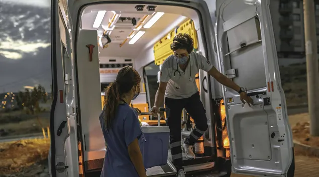 Ambulance with healthcare workers