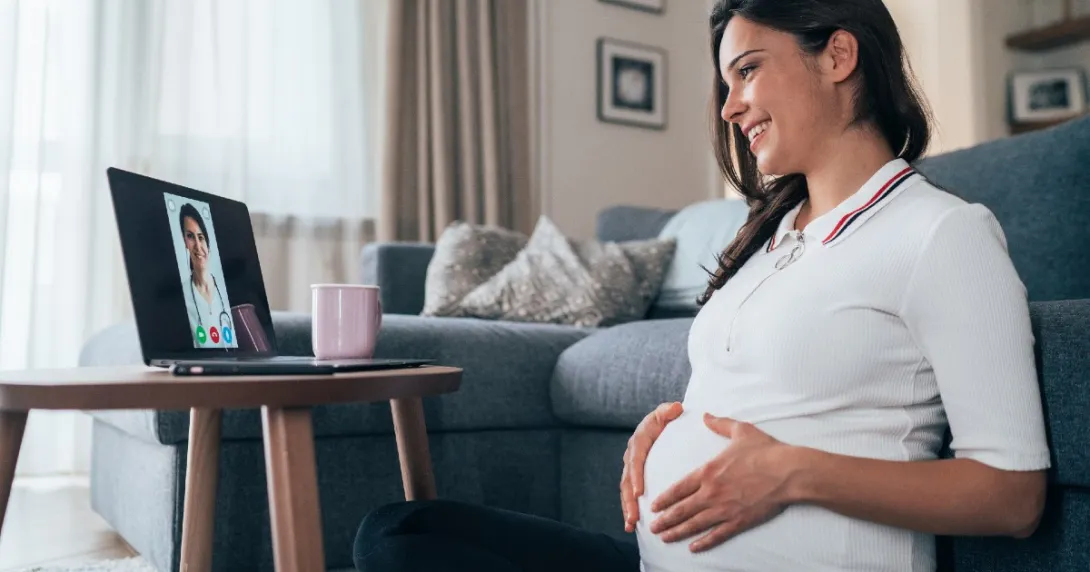 Pregnant woman attending telehealth appointment