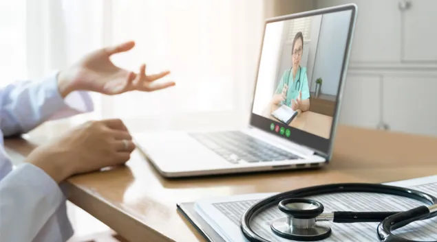 A telehealth consultation via laptop