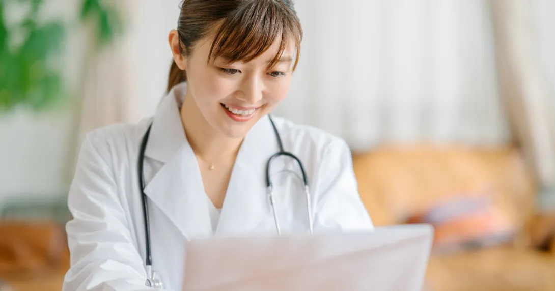 physician looking at paperwork