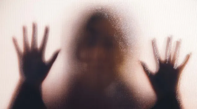 Person behind window